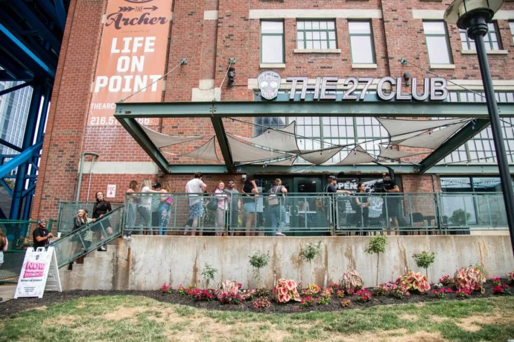 brick building with "the 27 club" storefront and outdoor seating area with flowers., 27 club coffee, cleveland