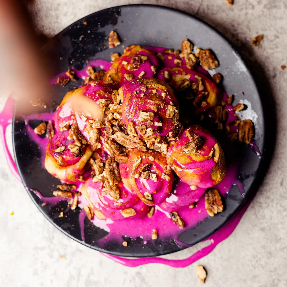 pink açai bowls topped with granola on dark plate with magenta handles., 27 club coffee, cleveland