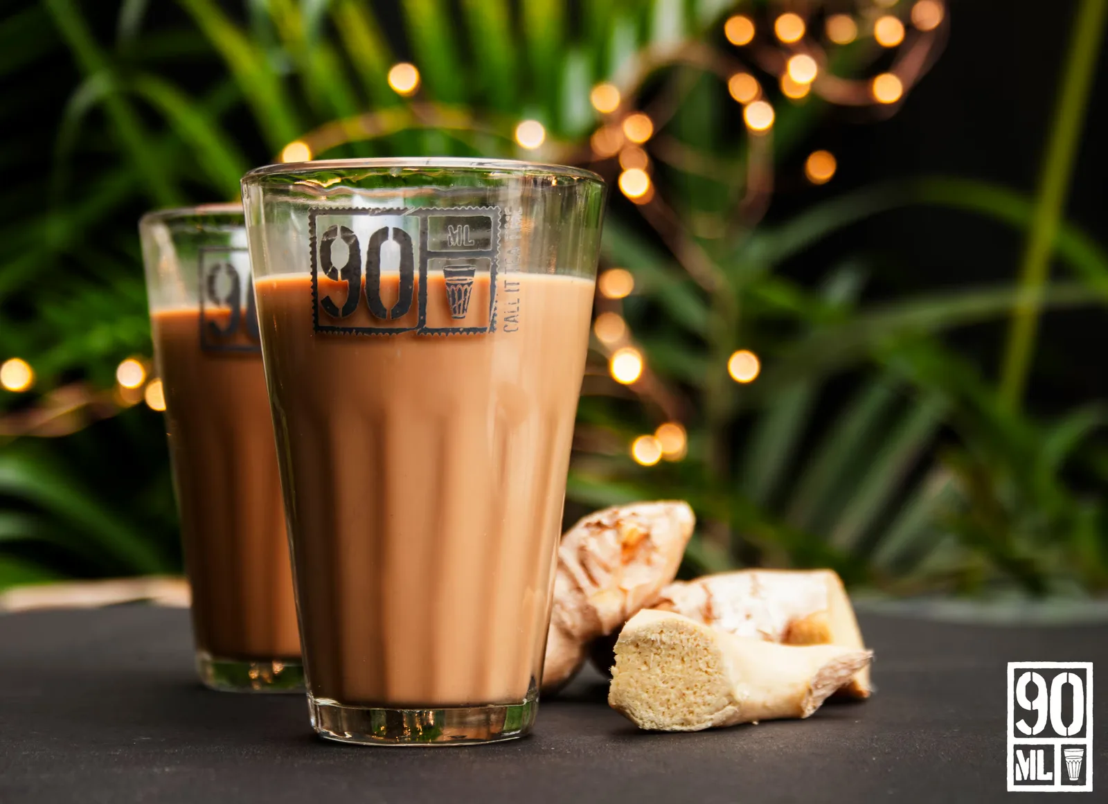 creamy coffee beverage with ginger root beside decorated glass with warm lights., 90ml, chennai