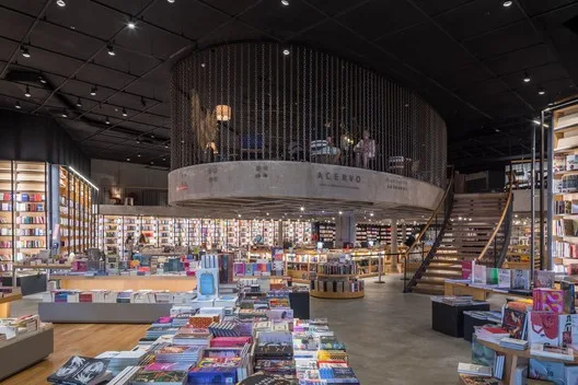 large modern bookstore with tiered display levels and extensive product merchandise throughout., acervo café - casa park, bra
