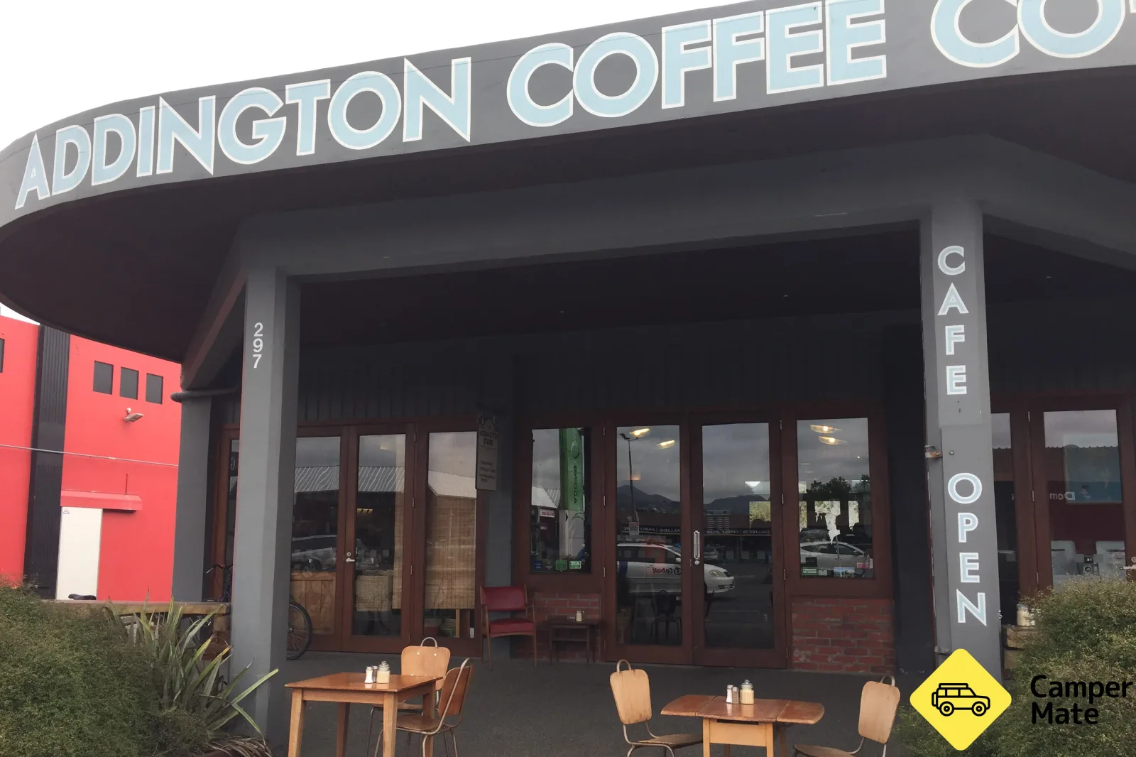 addington coffee storefront with outdoor seating and open signage., addington coffee co-op, christchurch