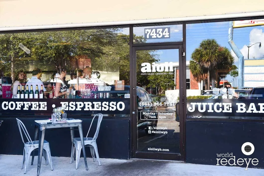 modern storefront with coffee, espresso, and juice bar offerings visible through windows., aioli, miami