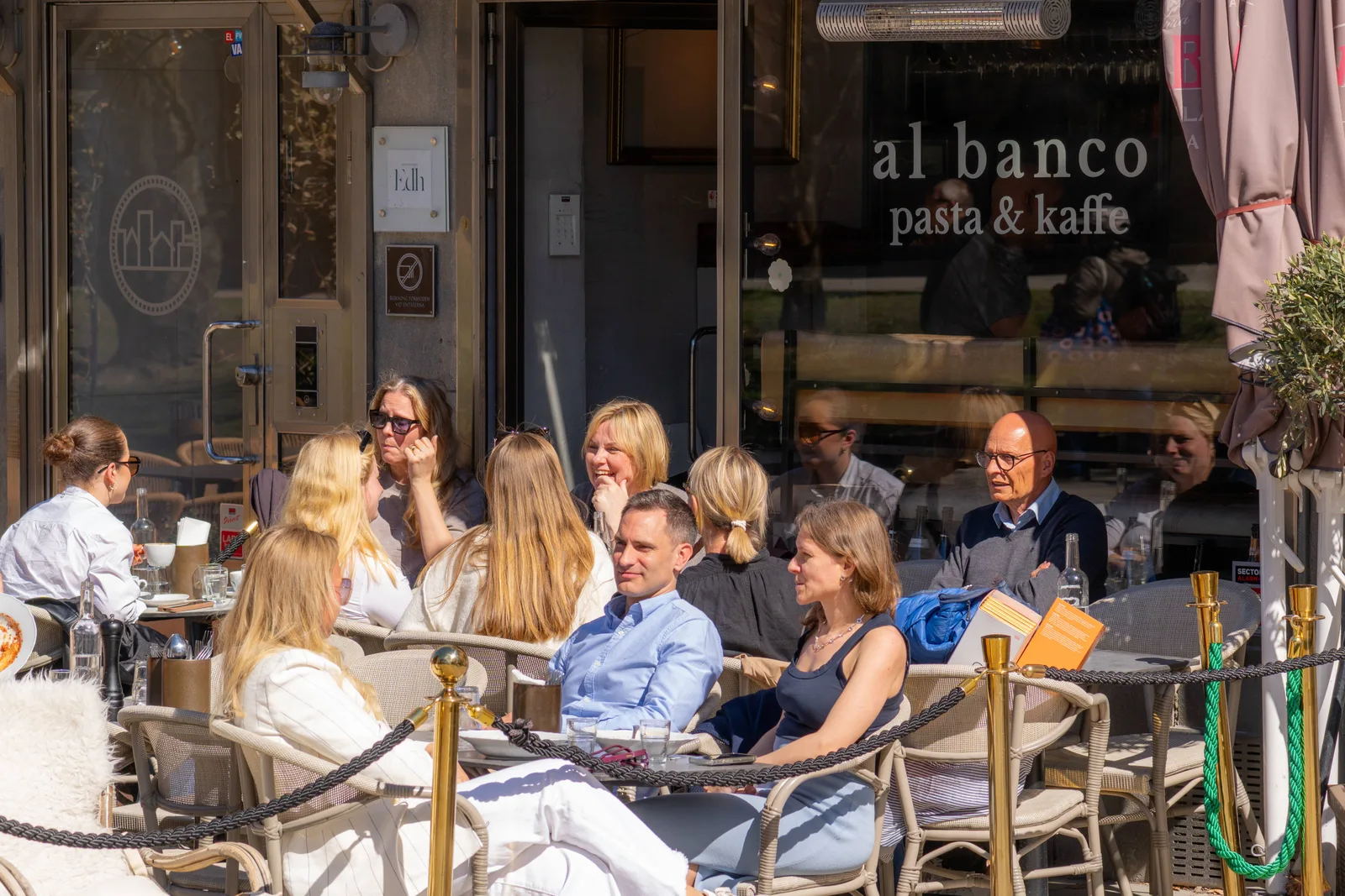 outdoor patio dining at al banco pasta and kaffe restaurant with seated guests., al banco, gothenburg
