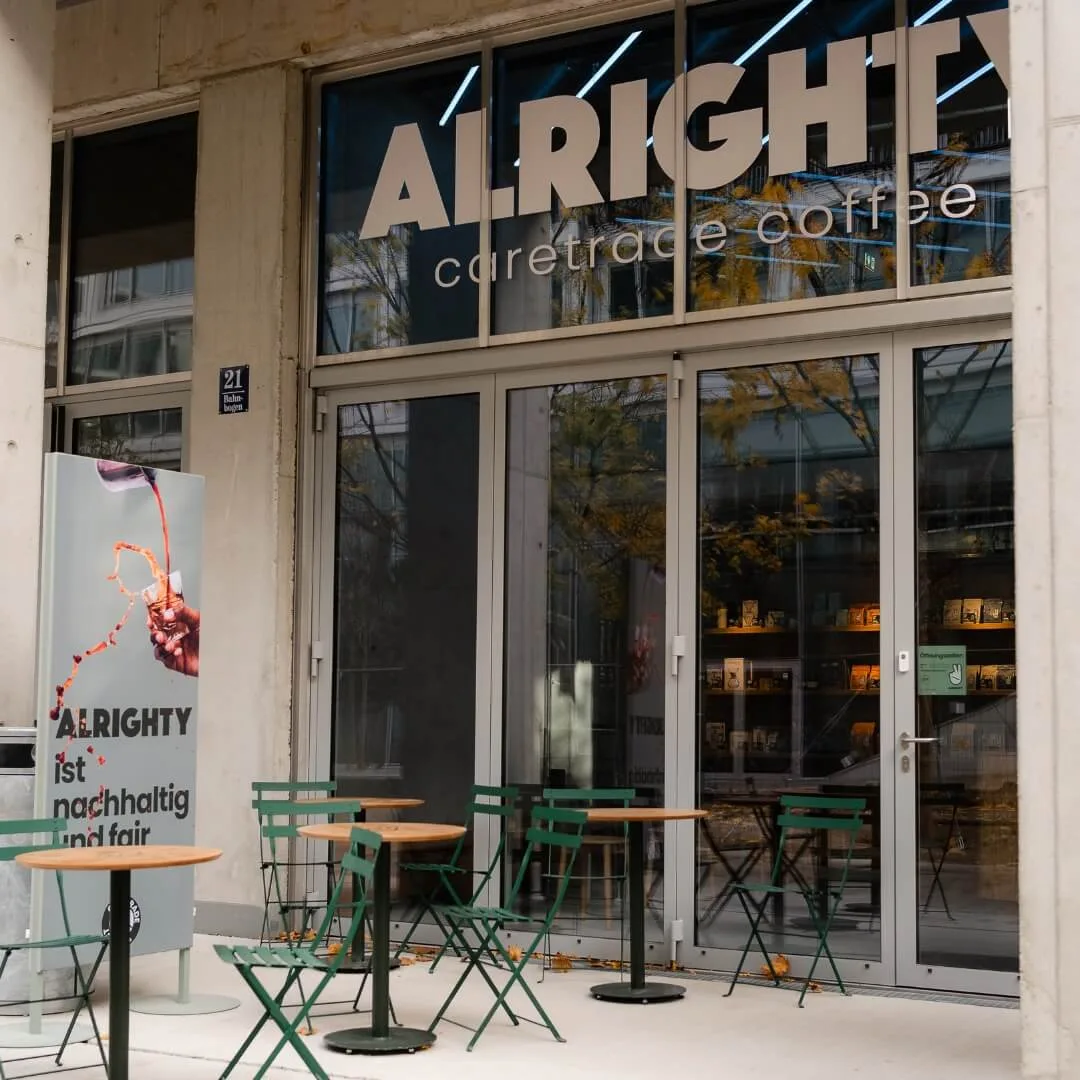 alright caretrade coffee storefront with green chairs and outdoor seating area., alrighty roastery & coffee shop, munich