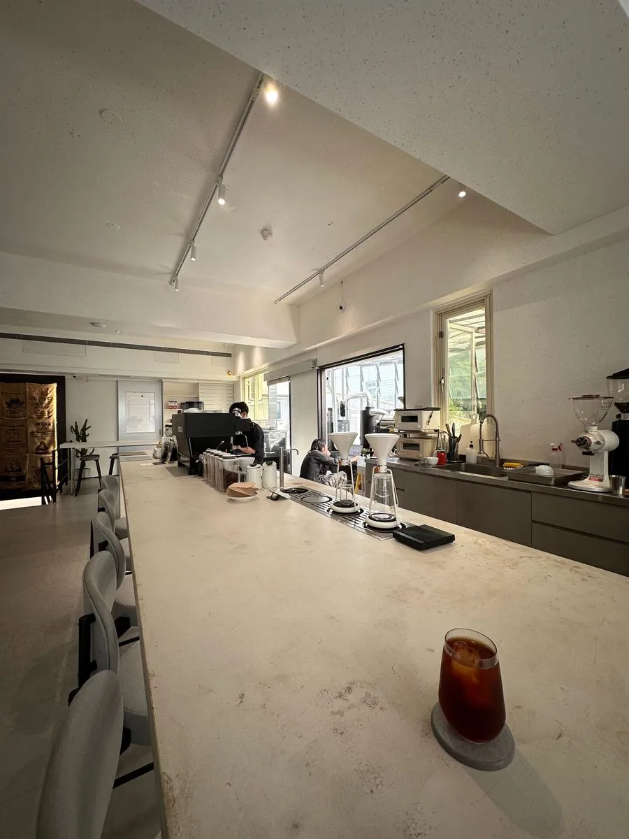 modern minimalist coffee shop with concrete counters and polished aesthetic interior., always day one cafe, taipei