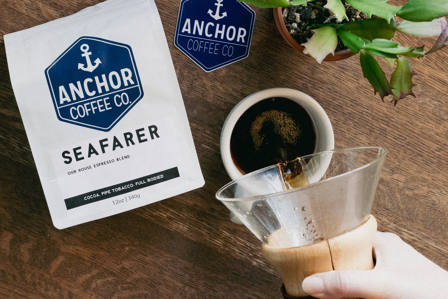 anchor coffee co. seafarer blend package with brewed coffee and filter setup on wooden surface., anchor coffee co, north wilk