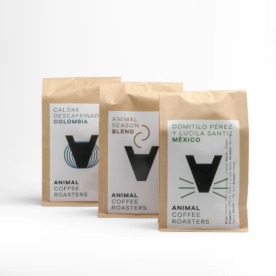 three kraft coffee bags from animal coffee roasters featuring minimalist black animal logo designs., animal coffee roasters -