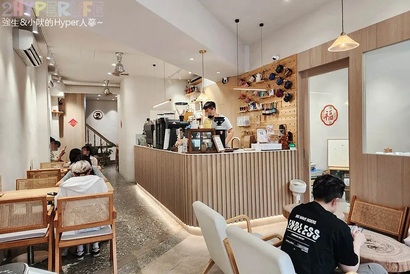modern café interior with wooden counter, rattan chairs, and seated customers., 青燕焙煎所aoiwa coffee - 賣牛肉麵的咖啡館, taichung