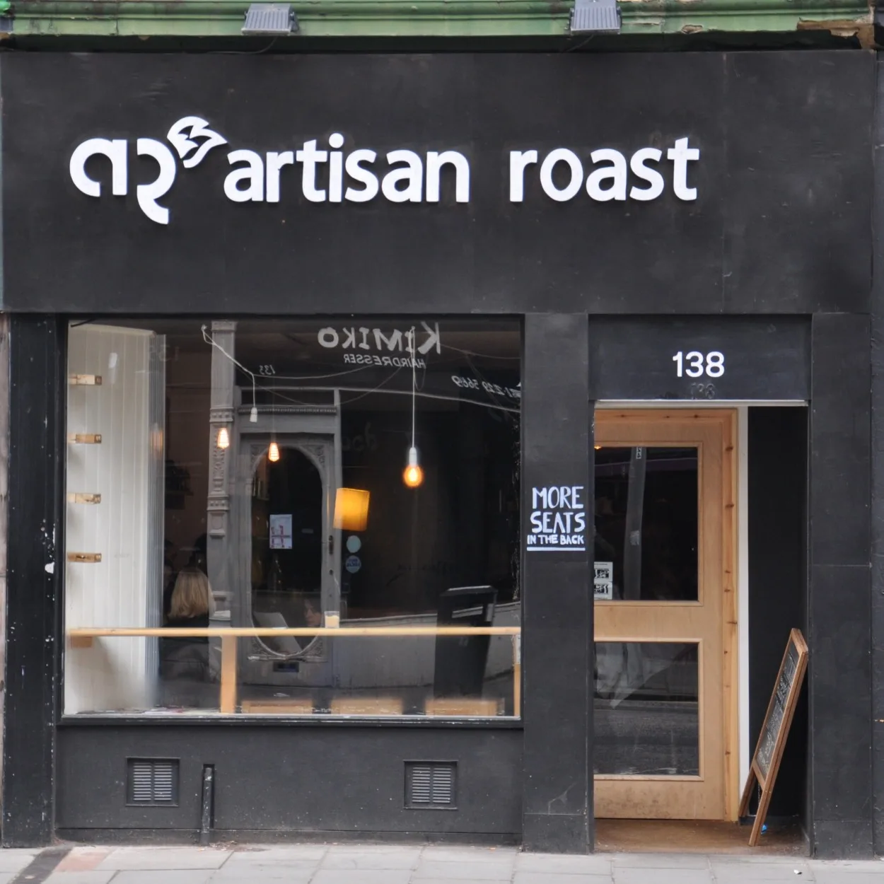 black storefront for artisan roast coffee shop at street address 138., artisan roast bruntsfield, edinburgh
