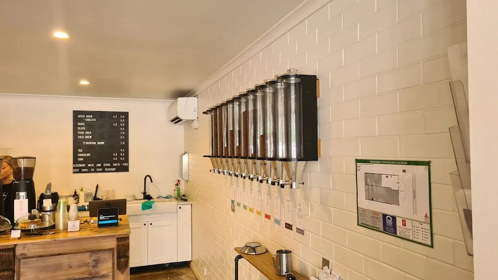 modern coffee shop interior with tap dispensers, menu board, and brick wall tiling., b3 coffee, blackwood