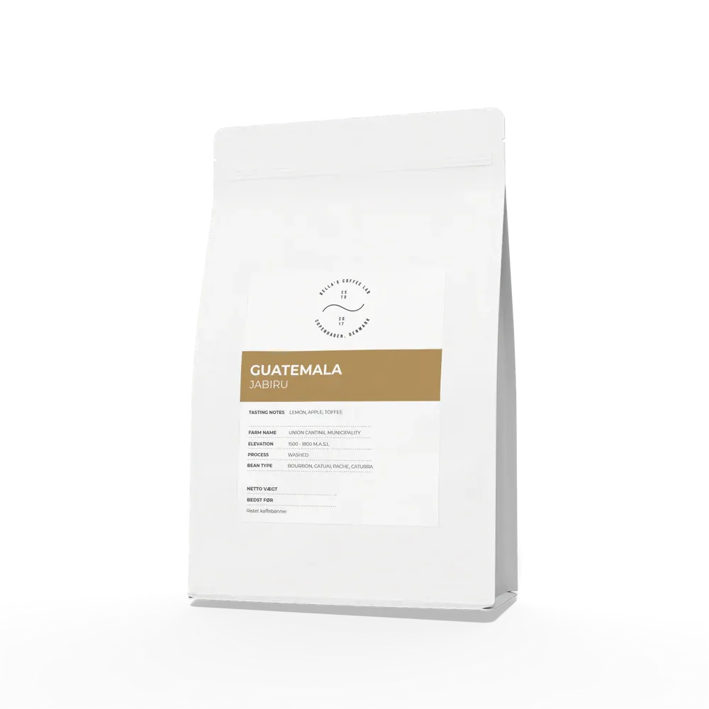 white coffee bag with gold label reading "guatemala jabiru" against plain background., bellas coffee lab roastery, københavn 