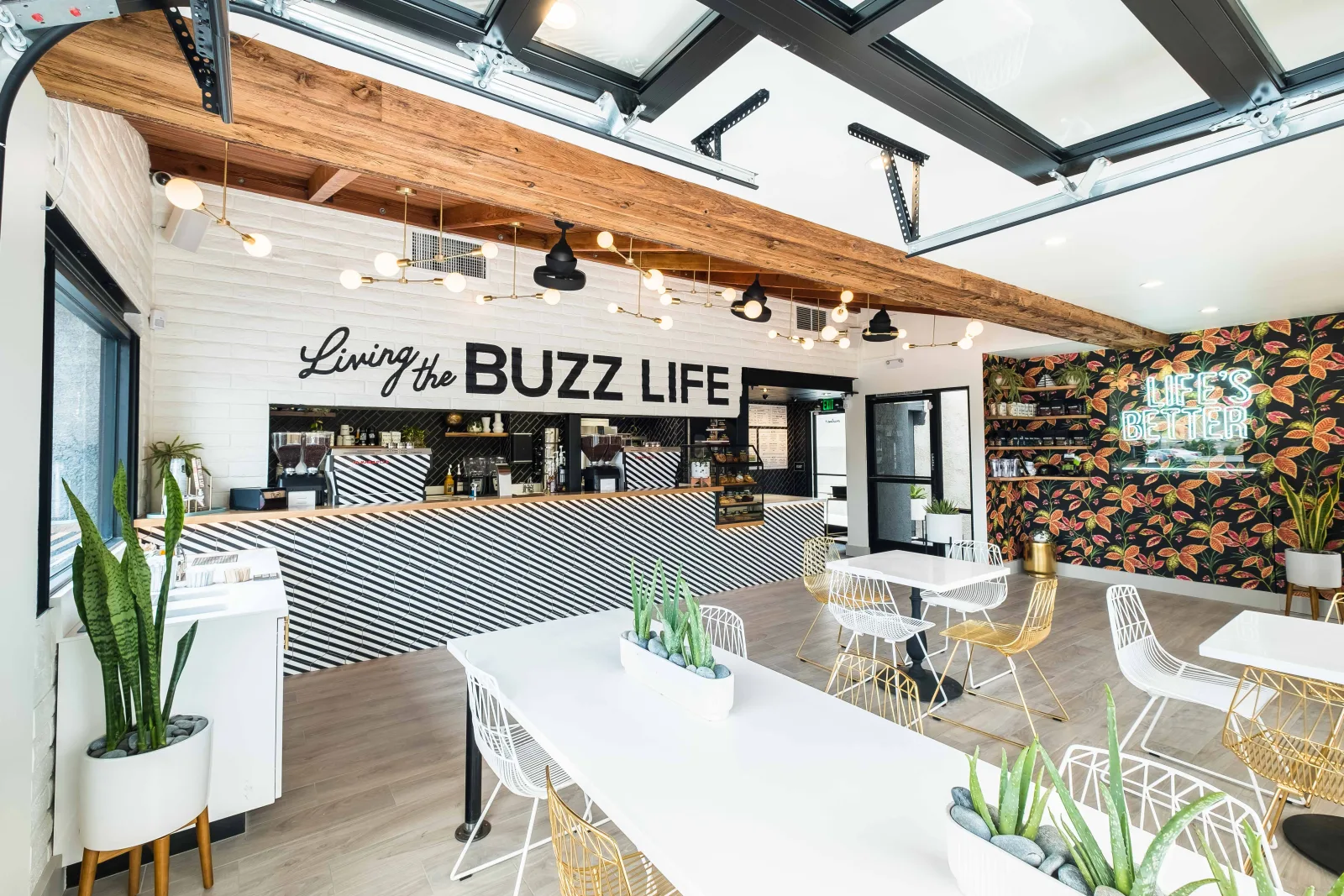 modern office break room with "living the buzz life" branding and striped counter design., better buzz coffee mission beach, 