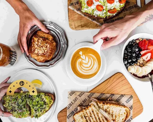 overhead view of healthy breakfast spread with avocado toast, latte art, and fresh berries., better buzz coffee point loma, s