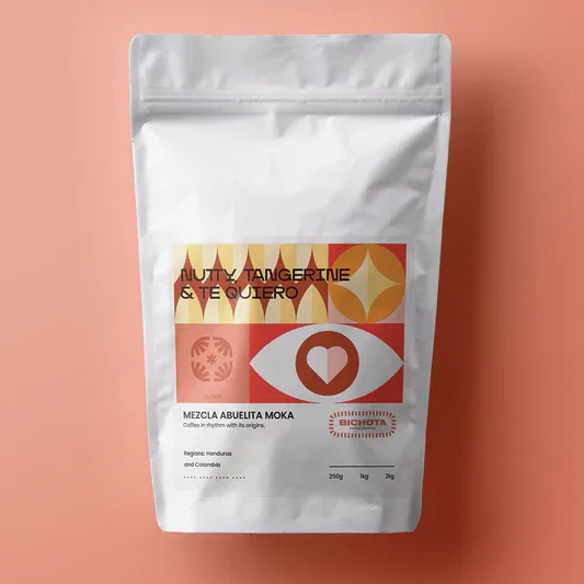 white resealable coffee bag with red and gold geometric design on salmon background., bichota coffee, minneapolis