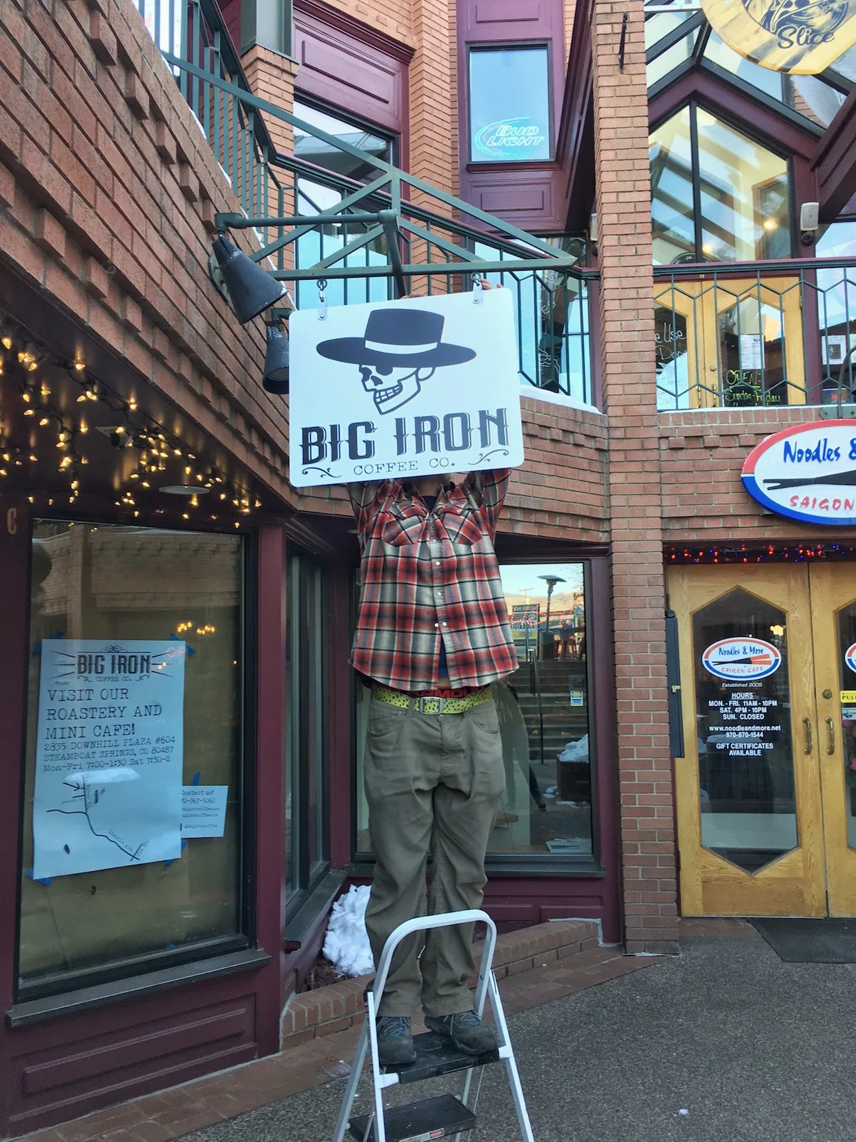big iron coffee co storefront with skeleton mannequin wearing plaid shirt and hat., big iron coffee co., steamboat springs