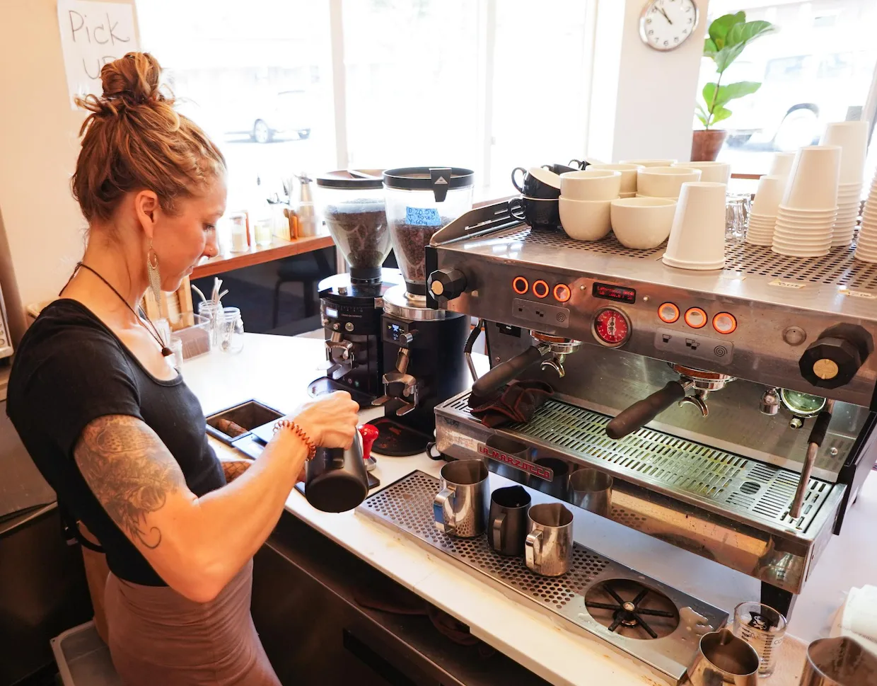 barista preparing espresso at professional machine in busy coffee shop., bluebell coffee usa, grass valley