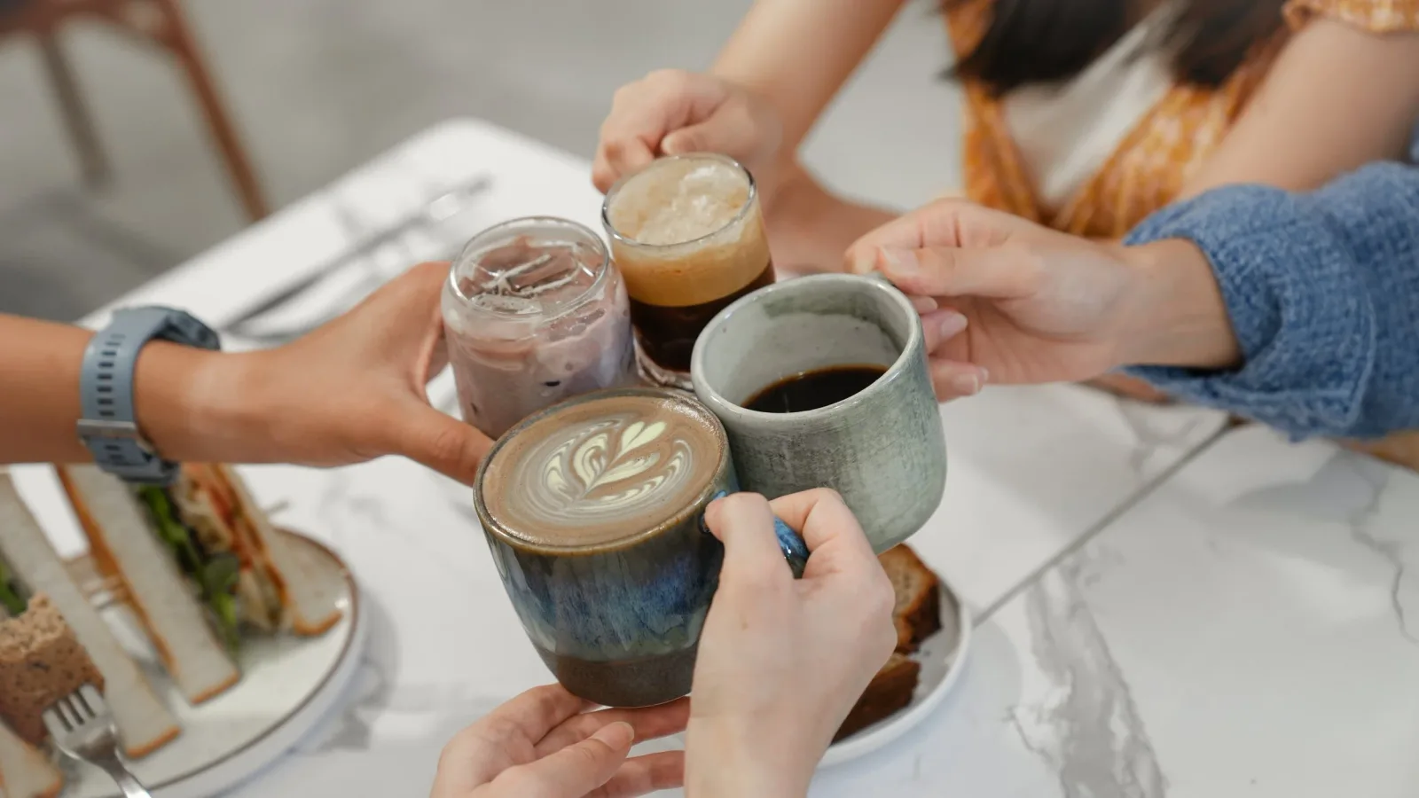 friends clinking coffee cups together at a casual brunch gathering., blueroom, taipei