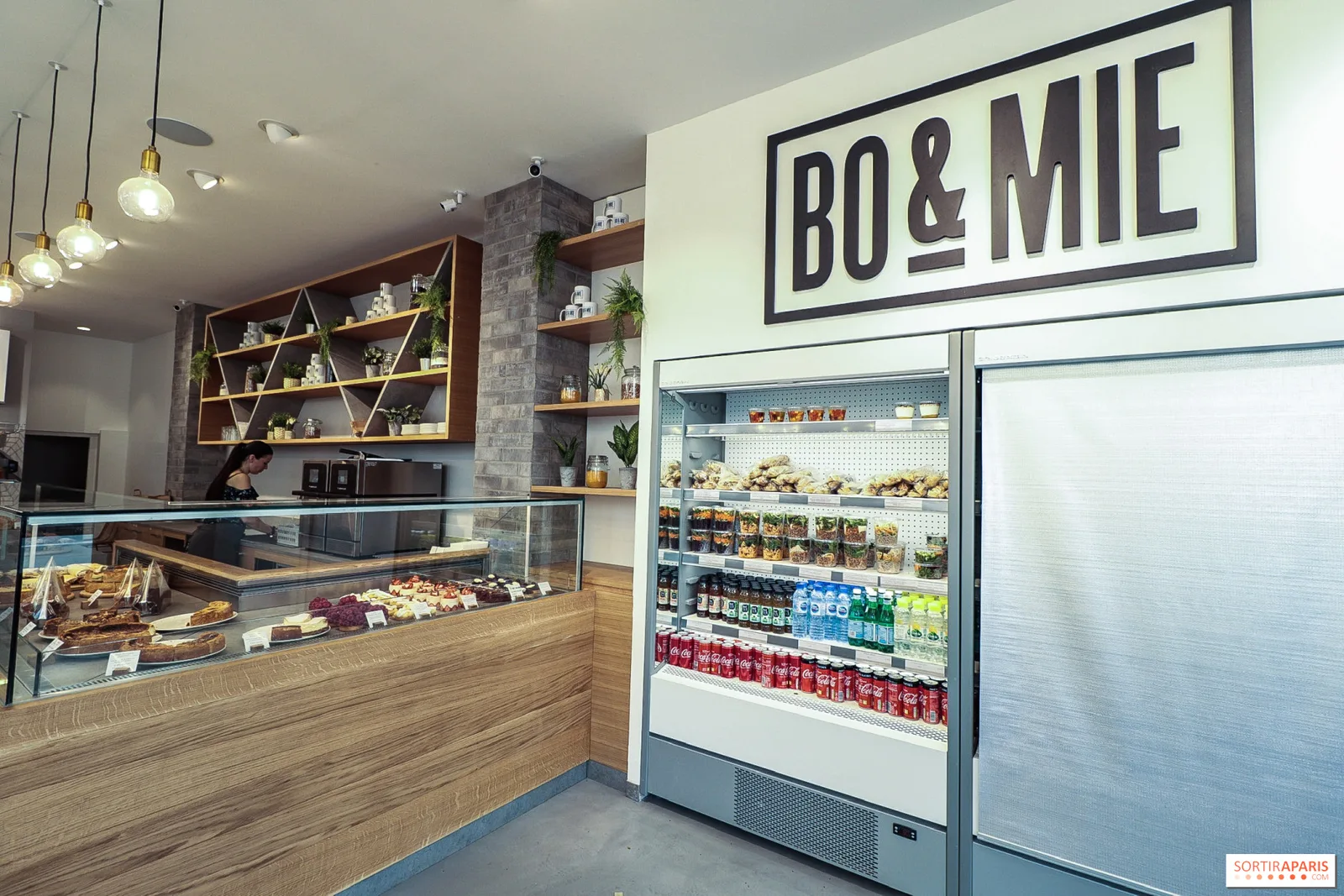 modern café interior with "bo&mie" signage, counter display, and refrigerated beverage cases., bo&mie - saint martin, paris