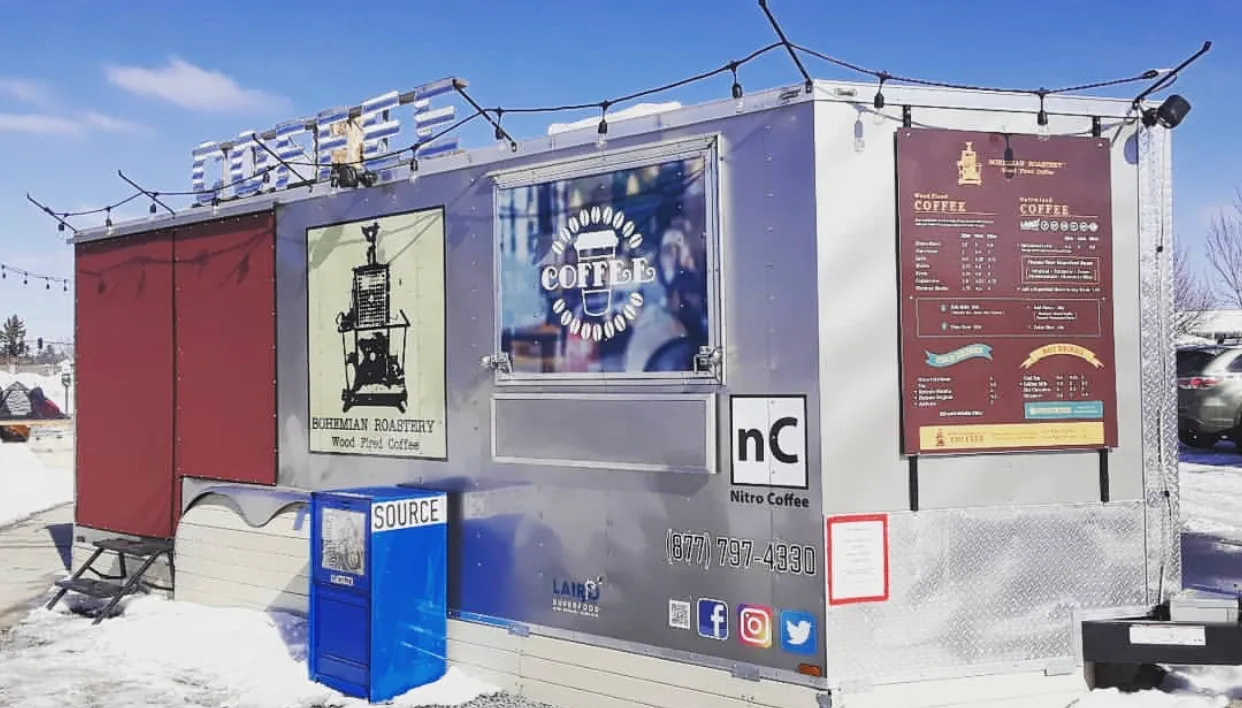 coffee food truck with menu boards, branding, and outdoor seating area visible., bohemian roastery, bend