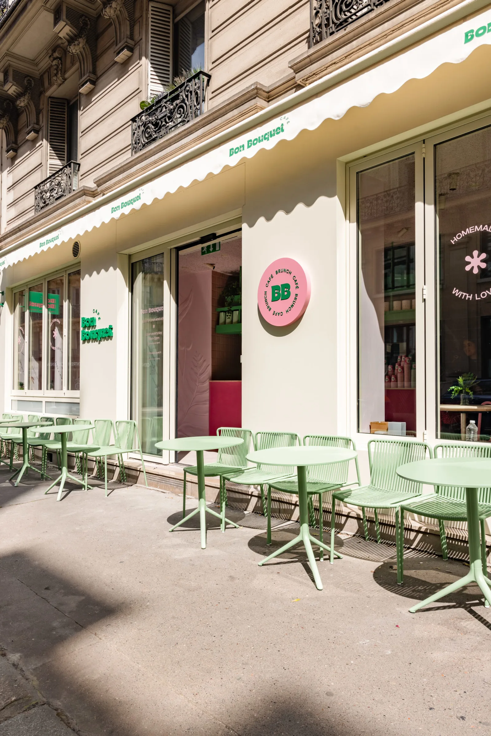 pastel green café seating outside bon bouquet storefront with awning., bon bouquet café, paris