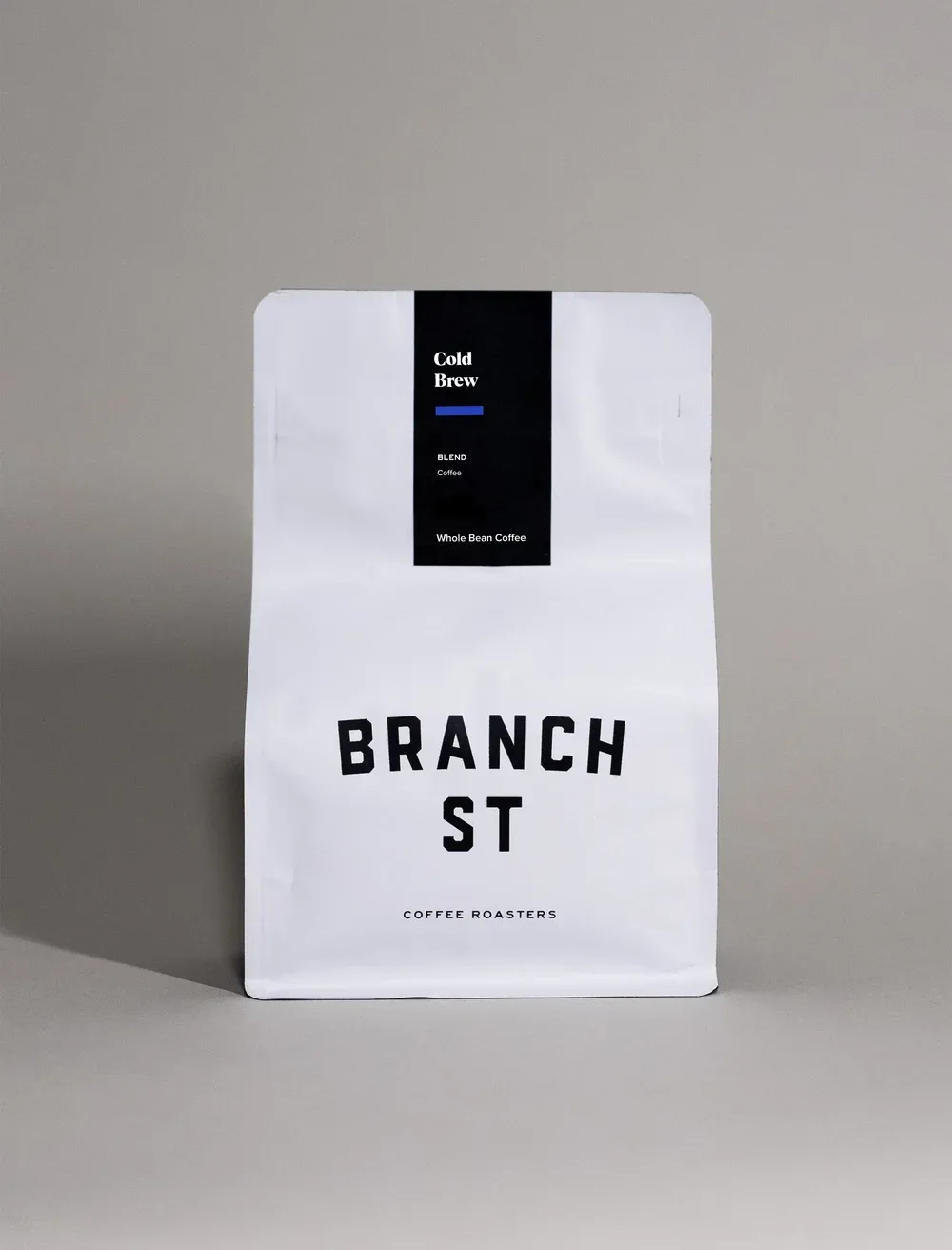 white coffee bag with black label reading "cold brew" and "branch st coffee roasters"., branch street coffee roasters, ohio