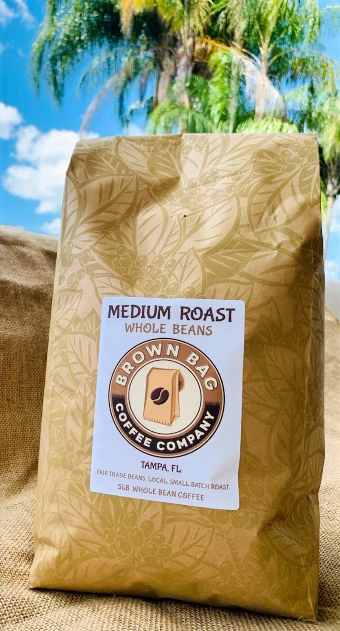 brown bag coffee company medium roast whole beans package outdoors under tree., brown bag coffee company, clearwater