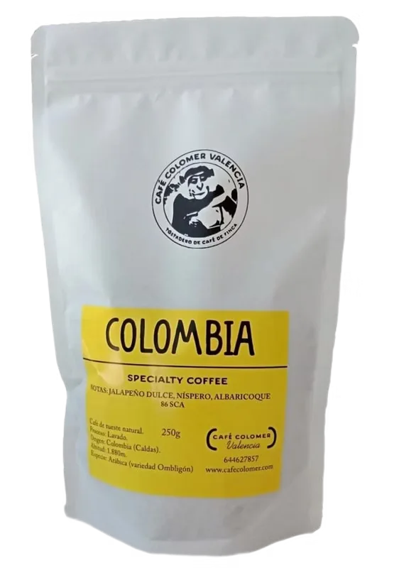 white coffee bag with yellow label reading "colombia" specialty coffee, 250g., café colomer specialty coffee roasters y cafet