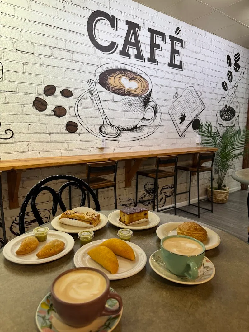 café display with pastries, baked goods, and two cappuccinos with latte art., cali cafe, riverview