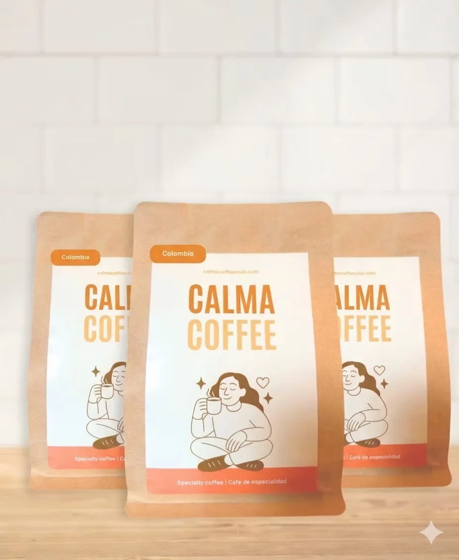 three kraft paper coffee bags labeled "calma coffee" displayed on wooden surface., calma coffee & drinks, bogotá