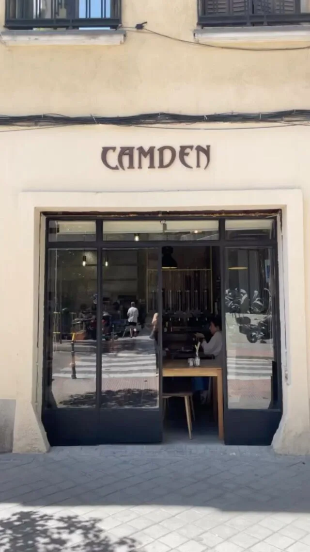 modern storefront with "camden" signage, black-framed glass doors, cream facade., camden coffee roasters (velilla de san anto
