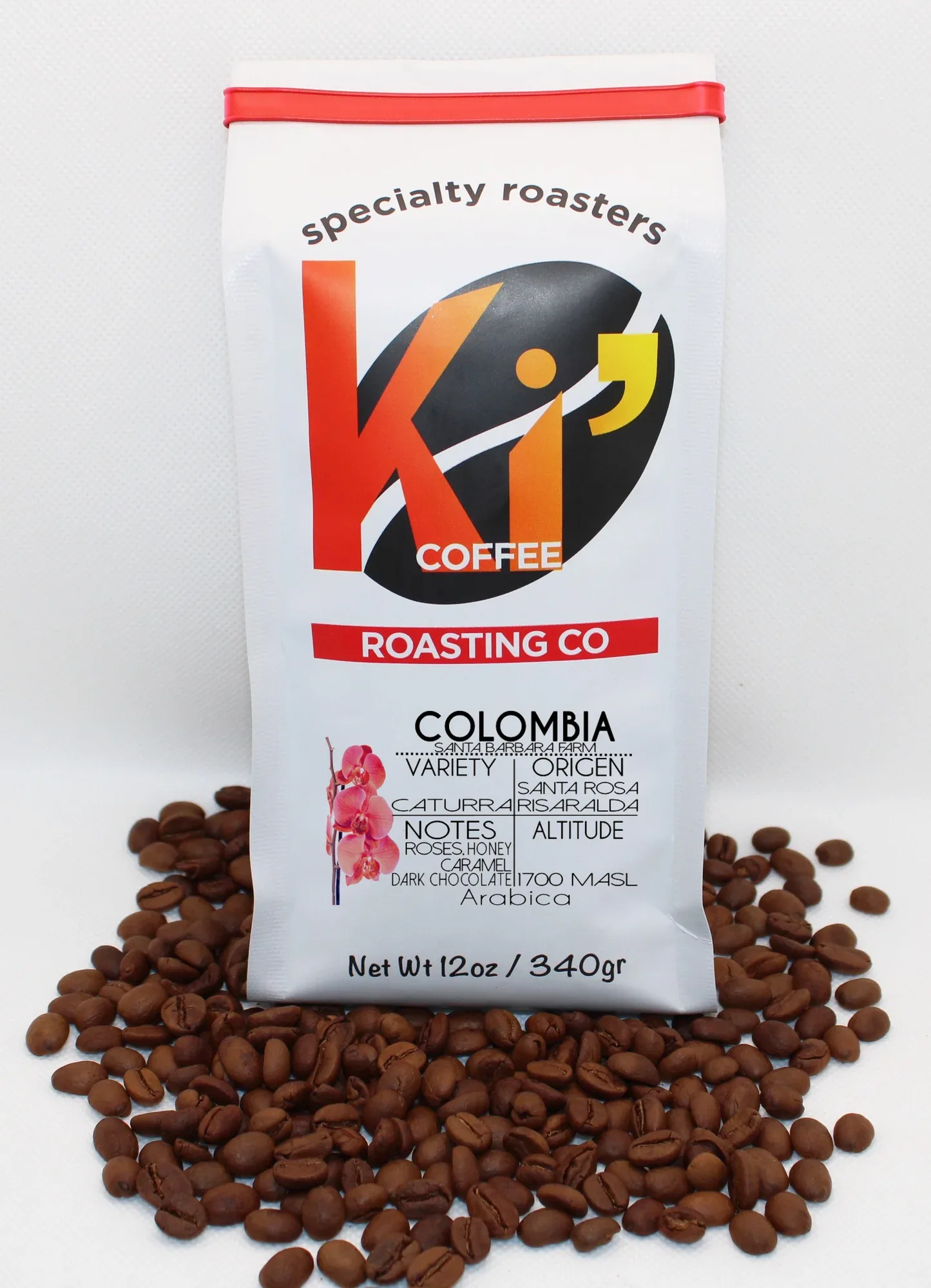 specialty coffee bag surrounded by roasted beans on white background., caturra coffee roasting company, sioux city