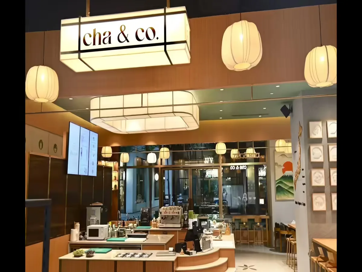 modern tea café interior with warm lighting and minimalist asian-inspired design elements., chaiyum, gurugram