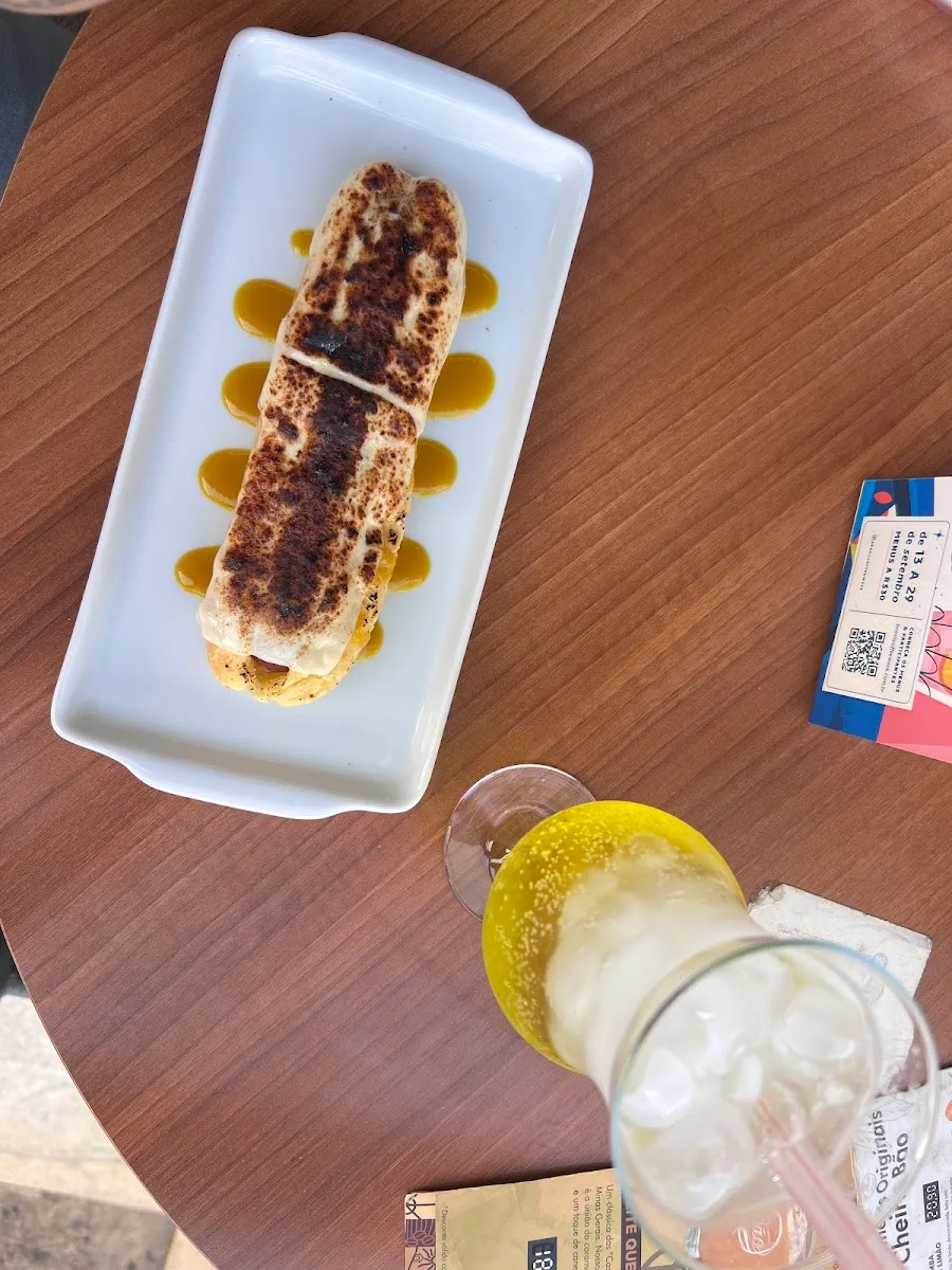 tiramisu dessert on white plate with lemon slices and cocktail., cheirin bão 313 norte, brasília