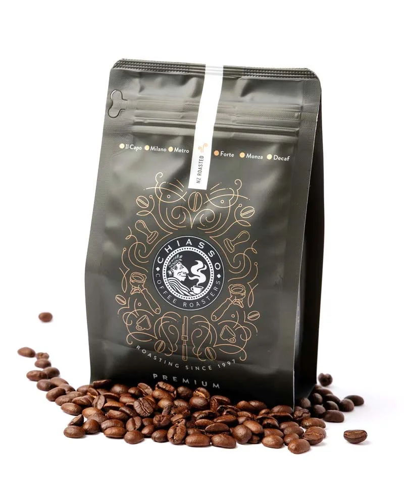 premium coffee bag surrounded by roasted beans on white background., chiasso coffee roasters, auckland