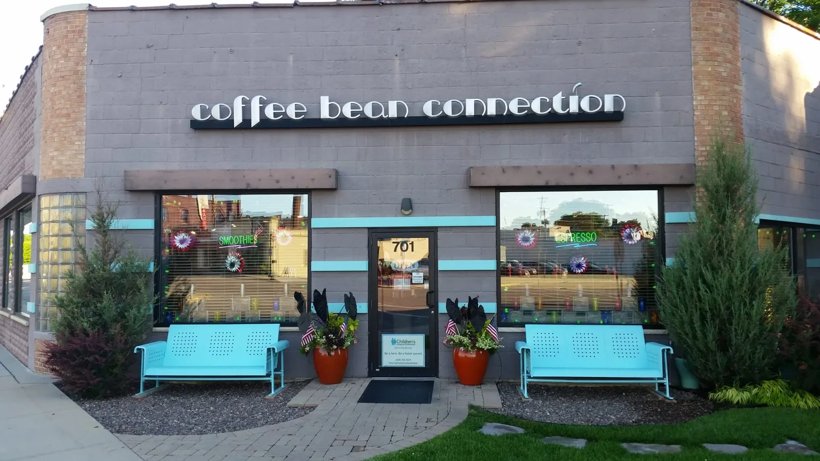 coffee bean connection storefront with turquoise benches and potted plants flanking entrance., coffee bean connection, wiscon