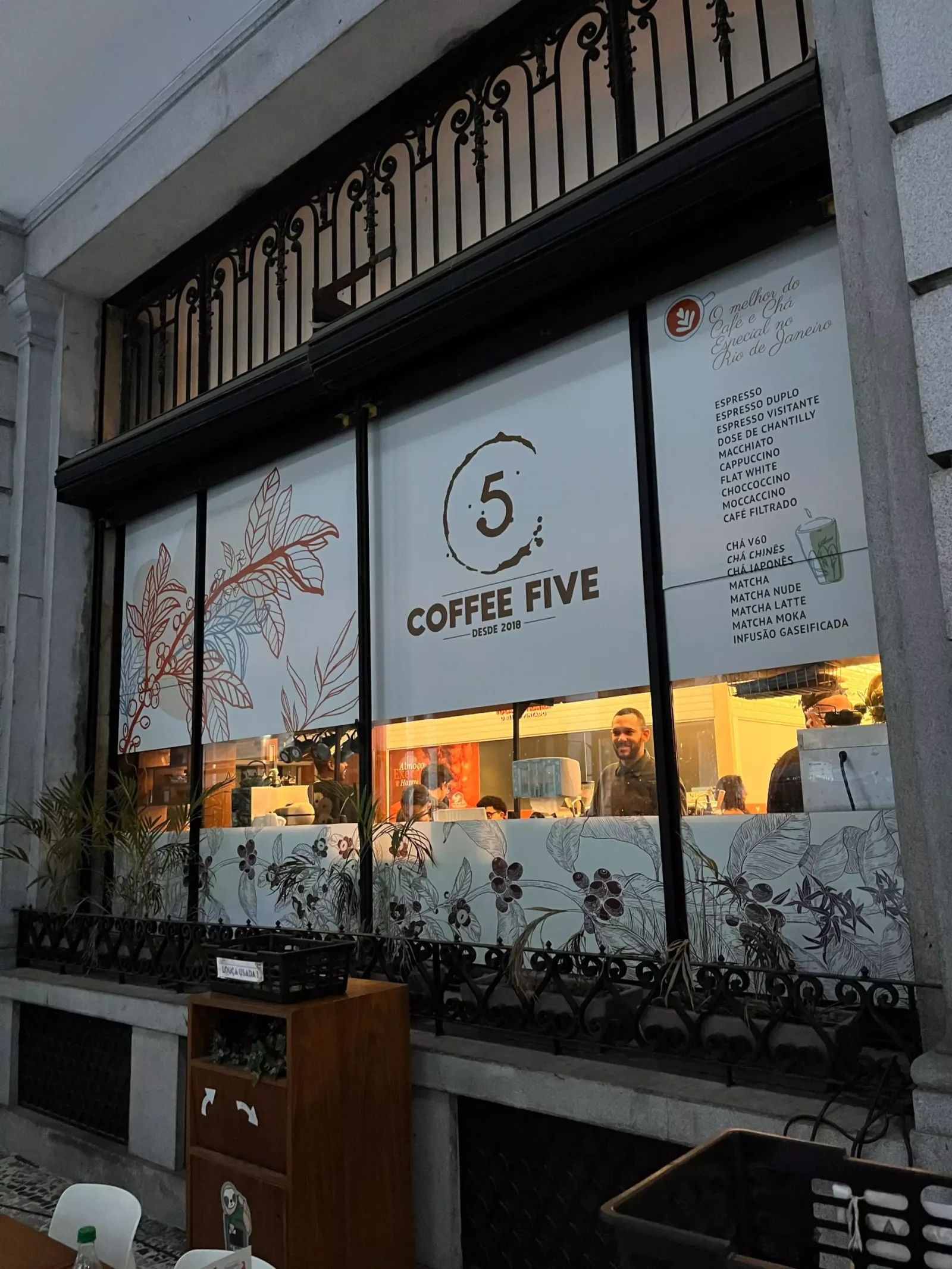 coffee five café storefront with ornate balcony and botanical window displays., coffee five, rio de janeiro
