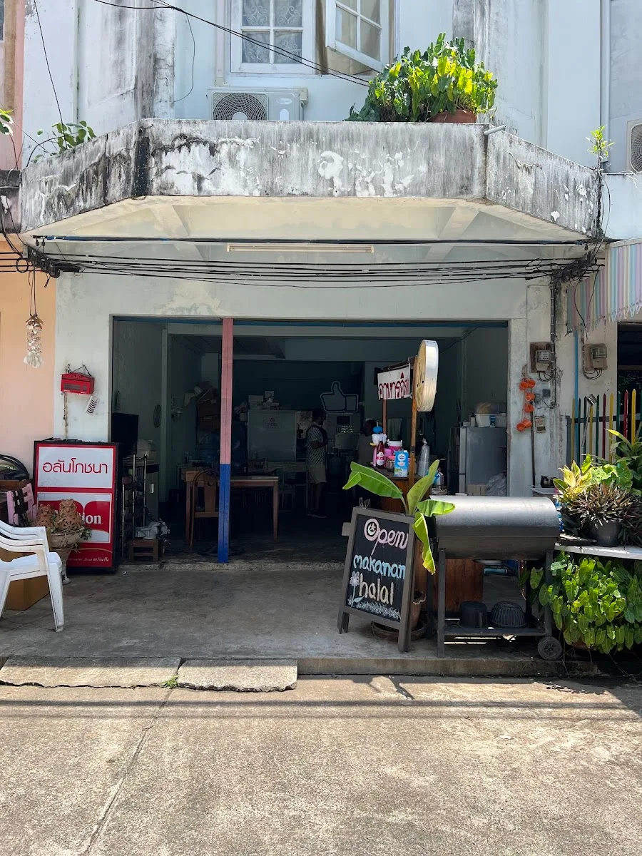 small thai street food shop with open storefront and weathered upper level., coffee near me.patong x rush coffee — specialty 