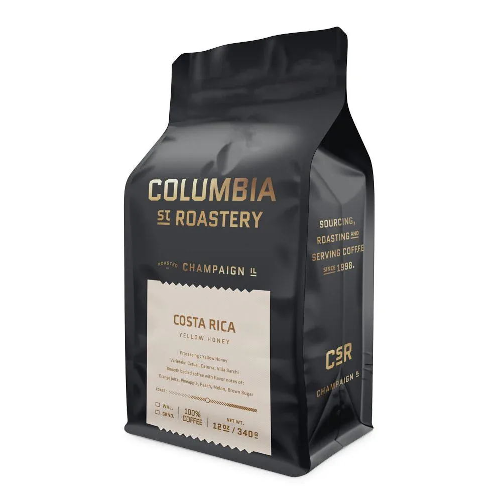 black coffee bag with cream label featuring costa rica yellow honey blend., columbia street roastery, champaign
