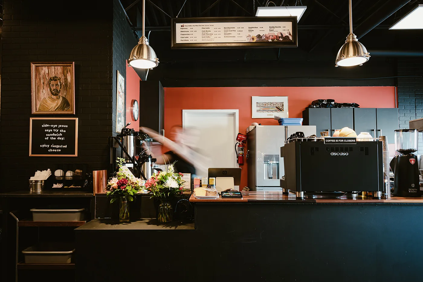 modern coffee shop counter with espresso machine, menu board, pendant lighting, and floral arrangement., congress coffee comp