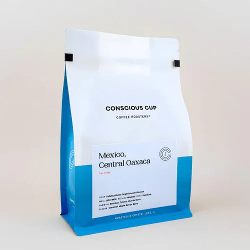 white and blue coffee bag labeled "conscious cup" from mexico, central oaxaca., conscious cup coffee roasters - crystal lake,