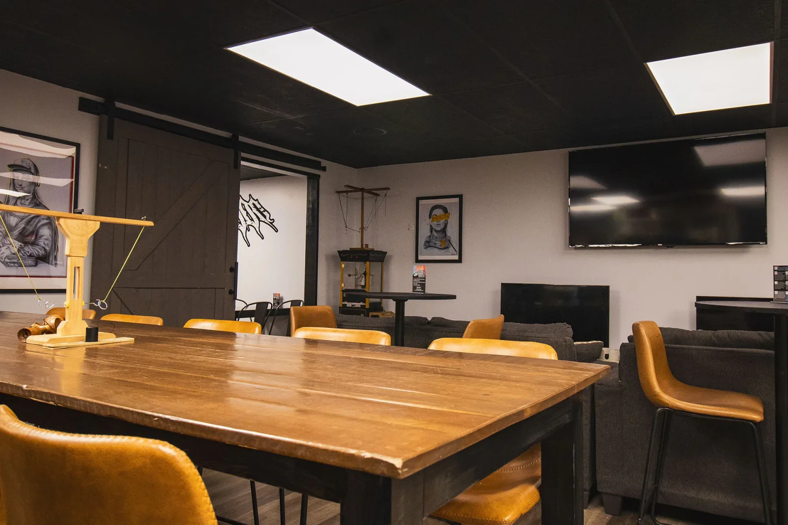 modern conference room with wooden table, mustard chairs, and flat-screen displays., convict coffee company, parker