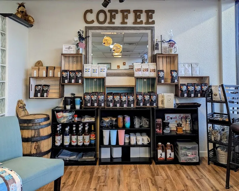 coffee shop counter displaying beans, equipment, and merchandise on wooden shelves., corter coffee roasters, colorado springs