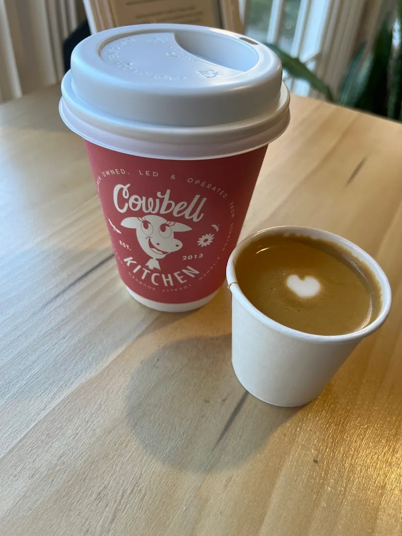 cowbell kitchen coffee cup with latte art heart in small white cup., cowbell kitchen, washington