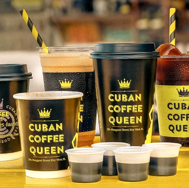 cuban coffee queen branded cups and drinks with yellow striped straws displayed., cuban coffee queen waterfront, key west