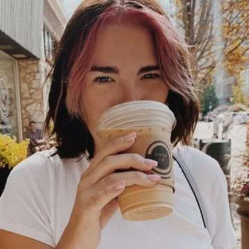 woman with pink hair drinking from a takeout coffee cup outdoors., custom cup coffee, illinois