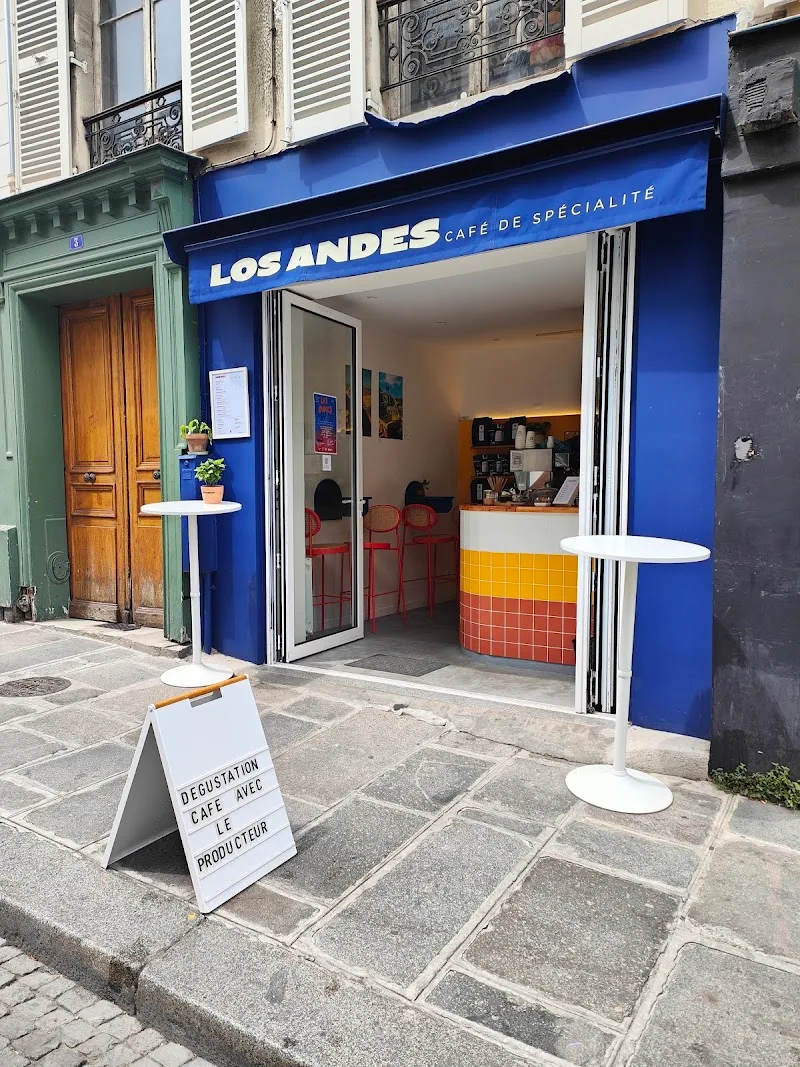 bright blue café storefront with "los andes" signage and outdoor seating., cusuaka cafés - boulogne centre, boulogne-billanco