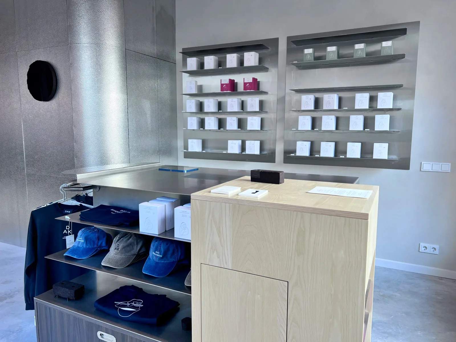 modern retail store interior with display shelves, merchandise counters, and product boxes., dak showroom by dak coffee roast