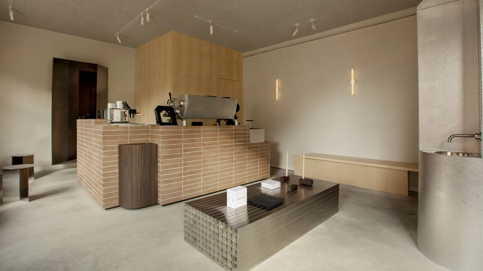 modern minimalist retail store interior with wooden counter and display table., dak showroom by dak coffee roasters, amsterda