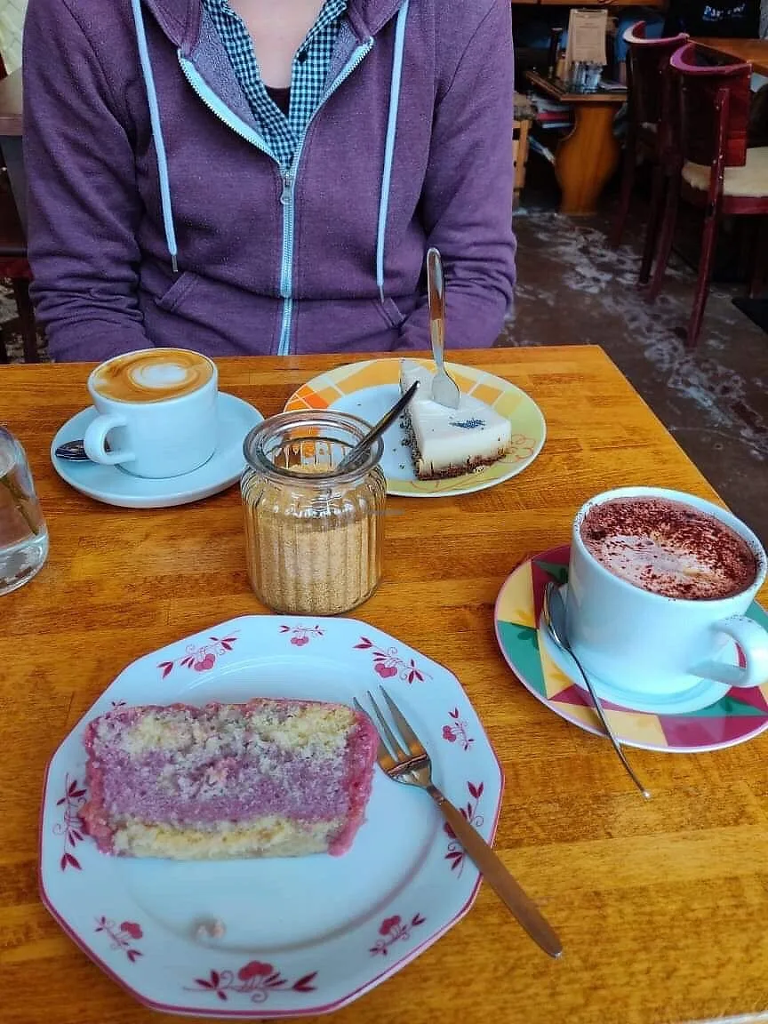 café table with sliced cakes, coffee beverages, and sugar jar., death presso, hamburg