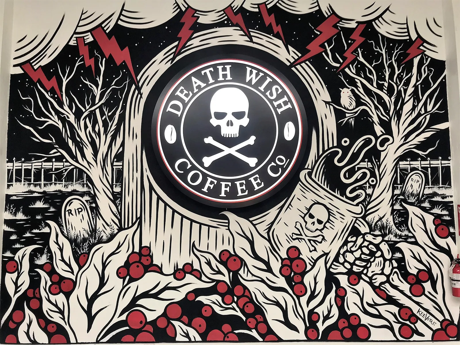 death wish coffee co. logo with skull and crossbones, surrounded by gnarled trees and berries., death wish coffee company, sa